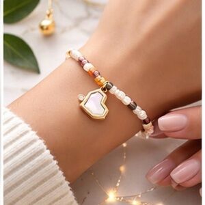 Elegant Gold and Multicolor Beaded Bracelet with Heart Charm